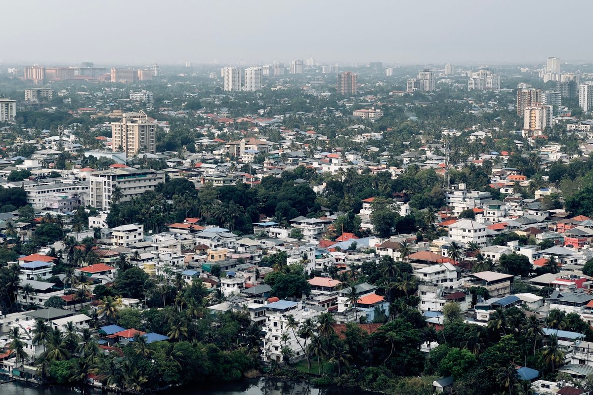 Aerial view over Ernakulam, Kochi, showing dense housing, high-rises and backwaters